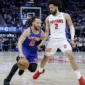 Guard New York Knicks, Jalen Brunson (11) mencoba melewati guard Detroit Pistons, Cade Cunningham (2) pada pertandingan gim ke 6 di Detroit.