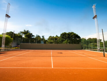 Photo of a tennis court. Tennis net.